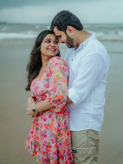 A beautiful, happy moment between Akshata and Sidhant on the beach. Their smiles show the pure joy of being together.