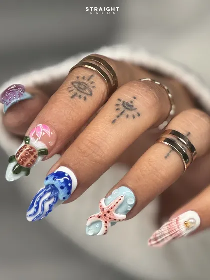 Your nails are my canvas. This set features incredibly detailed, hand-sculpted 3D marine life, including a sea turtle, jellyfish, and starfish, bringing a vibrant underwater world to your fingertips.