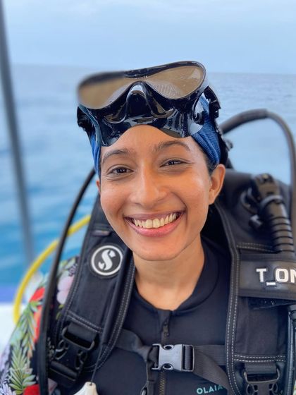 A smiling diver ready for her next adventure. Our community is full of passionate explorers from all backgrounds.