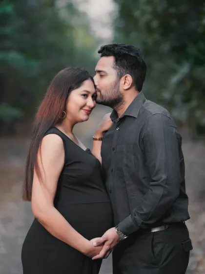 An intimate couple's portrait during an outdoor maternity session. I guide couples into natural poses that highlight their bond, capturing the quiet and loving moments before their family grows.