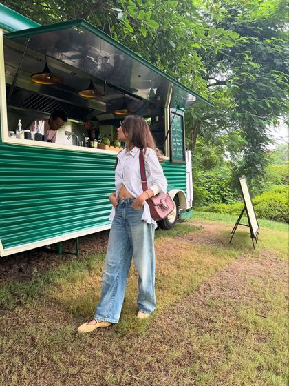 This outfit is all about the relaxed silhouette. The half-tucked shirt gives it a casual, effortless feel.