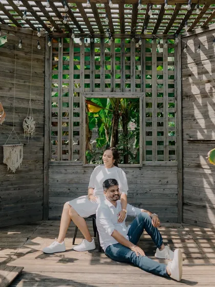 A relaxed and stylish portrait from a resort shoot. The play of light and shadow from the overhead lattice adds a beautiful texture to this candid moment.