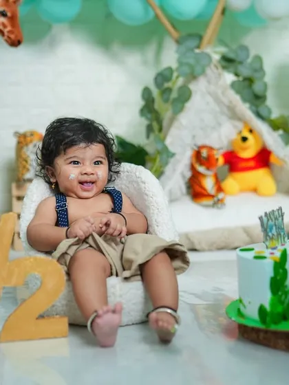 Celebrating the half-birthday milestone is a wonderful way to see how much your baby has grown. This jungle-themed cake smash setup was perfect for this happy six-month-old.
