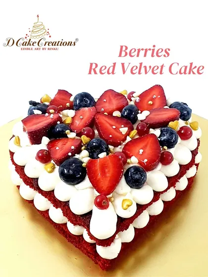 A heart-shaped red velvet cake topped with fresh mixed berries. It's the perfect cake for an anniversary, Valentine's Day, or just to show some love.