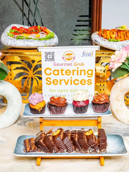 I offer a delightful range of desserts to satisfy your sweet cravings. This display features assorted cupcakes and rich chocolate pastries, beautifully presented for your event.