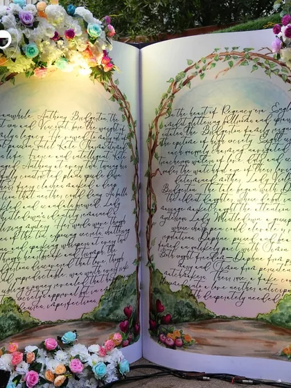 Another view of the magnificent hand painted storybook backdrop, showcasing the incredible artistry and attention to detail that went into this statement piece.