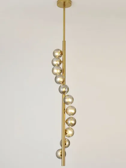 A spiral pendant with smoked glass globes, perfect for a staircase or a room with a high ceiling. The design draws the eye upward.