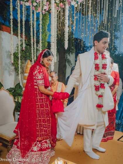 The 'saat phere' is a beautiful tradition. The decor, with its hanging floral strings and soft lighting, creates a gentle and respectful ambiance for these important rituals.