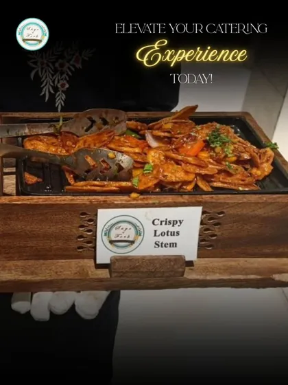 Our service is all about elevating your catering experience, one dish at a time. Here, one of our team members presents a freshly prepared platter of Crispy Lotus Stem, a popular and delicious appetizer perfect for any house party or celebration.