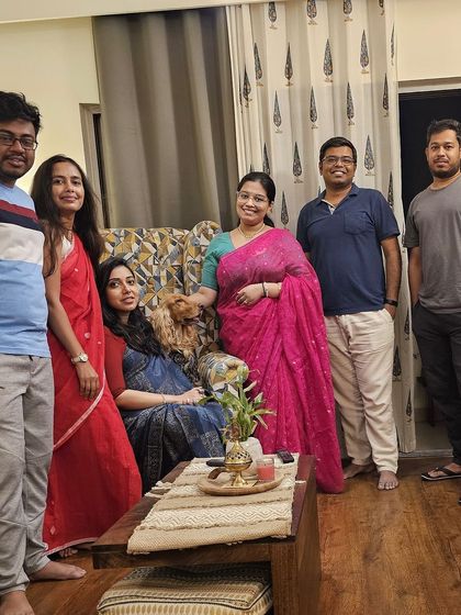 A group photo with friends and family at our home for the baby shower celebrations.