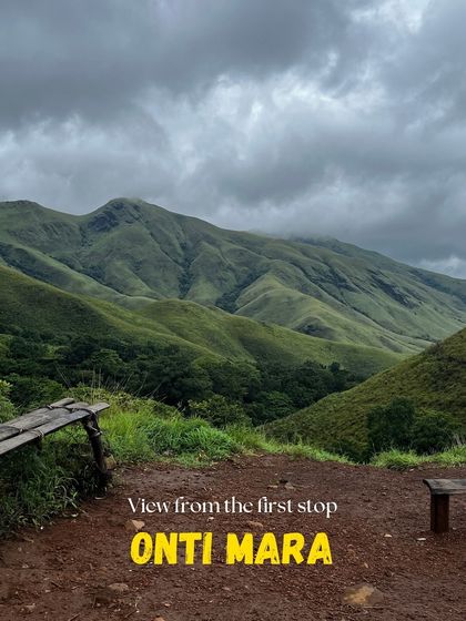 The view from 'Onti Mara' (Lone Tree), a famous landmark and resting spot on the Kudremukha trek, offering a stunning panorama of the surrounding hills.