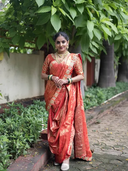 This stunning red and gold brocade Nauvari is a classic choice for a Maharashtrian bride. It’s rich, traditional, and absolutely beautiful.
