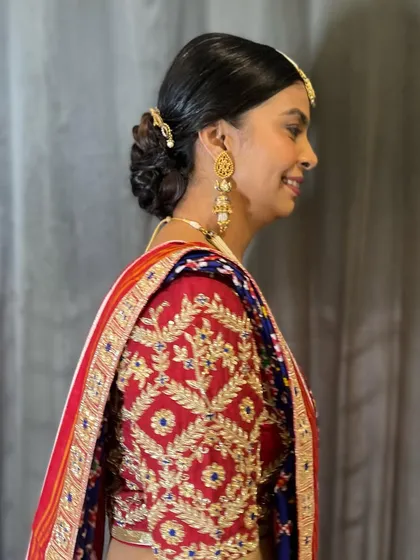 A side profile of the classic braided bun, showcasing its elegant shape and how beautifully it sits at the nape of the neck.