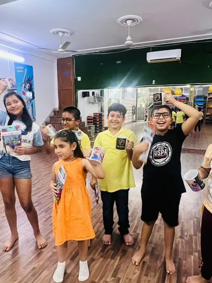 Happy faces after a great session. I believe in celebrating small wins, and here the kids are proudly showing off their prizes. This is the kind of positive community we are building.