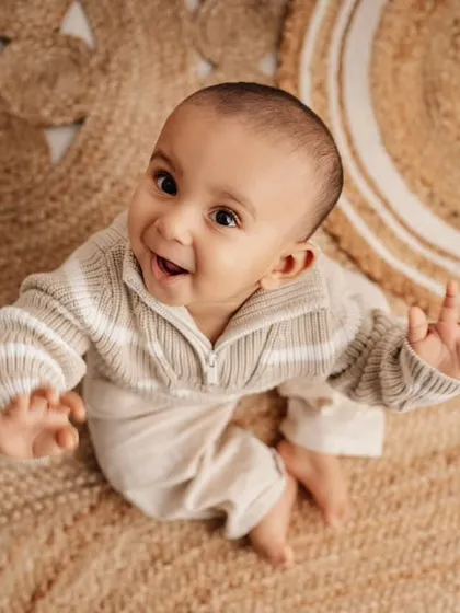 A happy, upward glance from the birthday boy. This top-down angle is great for capturing their sweet faces and curious expressions.
