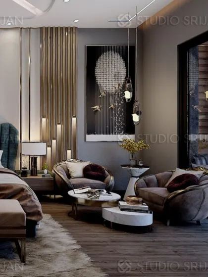 This view shows the cozy seating area within the Alameda bedroom, featuring two unique, rounded armchairs perfect for conversation.