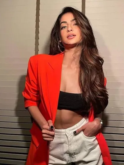 A closer look at the modern, casual chic outfit I styled for Palak Tiwari, featuring a bold red blazer over a black bandeau top and white denim shorts.