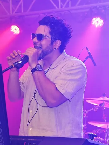Johaan at the keyboard during a high-energy set for a brand event. We bring the same passion and professionalism whether we're on a festival stage or at a corporate gala.