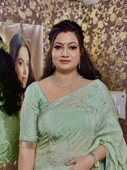 A portrait of my client, looking elegant and ready for her party. I did a soft glam makeup look with a simple hairstyle that complements her beautiful mint green saree.