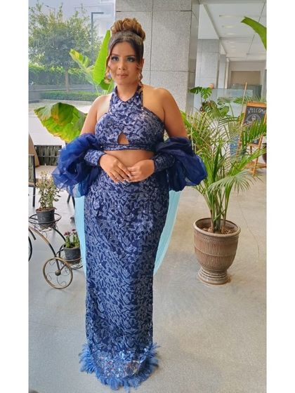 A complete look at a party makeover, perfect for an evening event. The client's makeup features a subtle smokey eye and a nude lip, which allows her stylish blue outfit to be the star of the show.