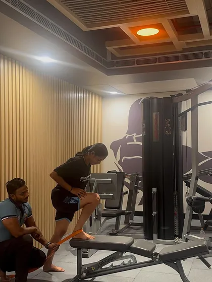 Working one-on-one with an athlete on a corrective exercise. We're using a resistance band to activate her glutes and improve her movement patterns.