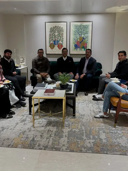 A relaxed moment with the team after the cake-cutting for Diljeet Titus. Camaraderie is just as important as courtroom strategy.