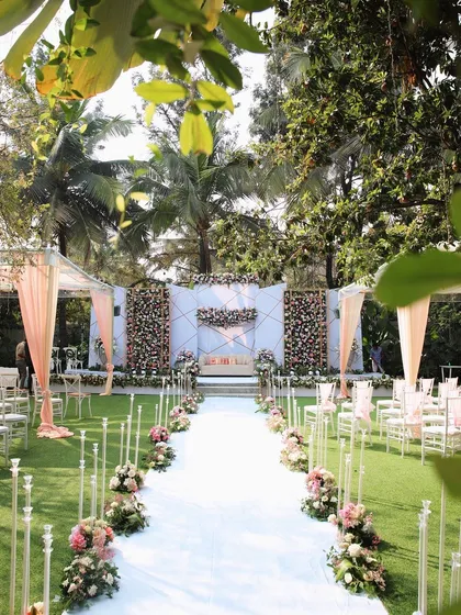 A beautiful daytime wedding ceremony at The Farmhouse Collective. The natural light filtering through the trees and the vibrant green lawn create a serene and picturesque setting for you to say "I do" surrounded by your loved ones.