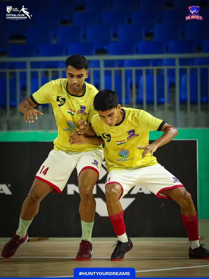 Two players syncing up during warmups, a small glimpse of the teamwork that defines us.
