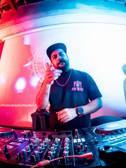 A fisheye shot of me at the decks in Roxy, pointing at the crowd.
