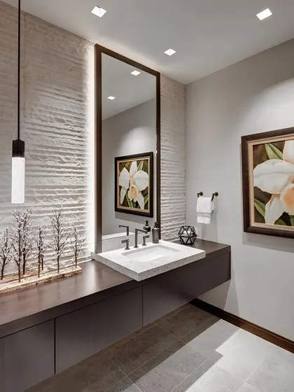 This powder room design combines texture and sophisticated lighting to create a luxurious feel. It features a floating vanity with under-cabinet storage, a modern vessel sink, and a textured accent wall highlighted by a stylish pendant light. We focus on creating elegant and functional bathroom interiors.