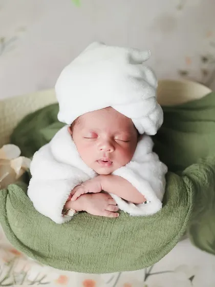A little spa day, anyone? We create these fun and whimsical scenes, like this one with a baby relaxing in a tiny tub surrounded by fluffy clouds, to make your newborn shoot extra special.