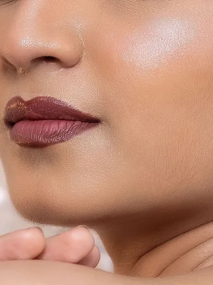 A close-up view of the skin finish I aim for. You can see the smooth texture and natural-looking highlight on the cheekbone. My technique focuses on creating a base that looks like real, healthy skin.