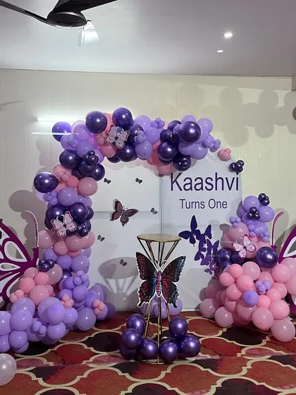 A slightly different angle of the purple butterfly theme, showing how the elements come together to create a perfect photo booth for the birthday girl and guests.