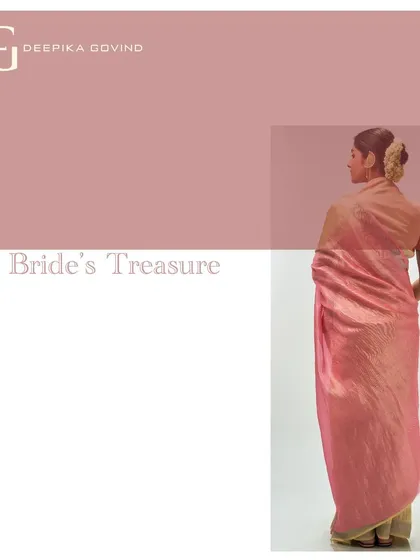 A back view of the pale yellow and rose tissue jacquard saree, showcasing the beautiful drape and the surprise of color on the pallu. This piece is a modern heirloom from 'The Bride's Treasure' series.