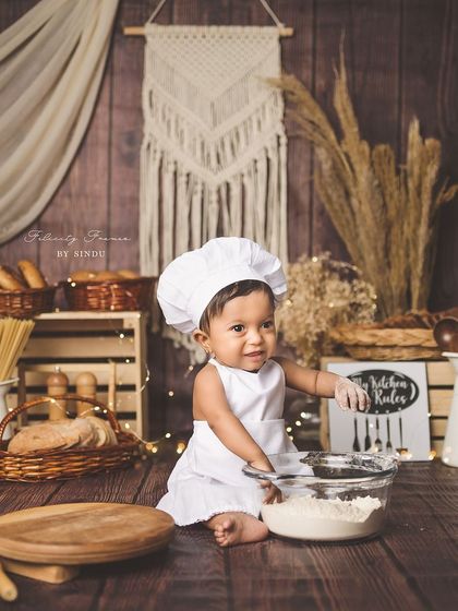 A wide shot of the chef-themed setup, complete with bread, pasta, and a "My Kitchen, My Rules" sign.