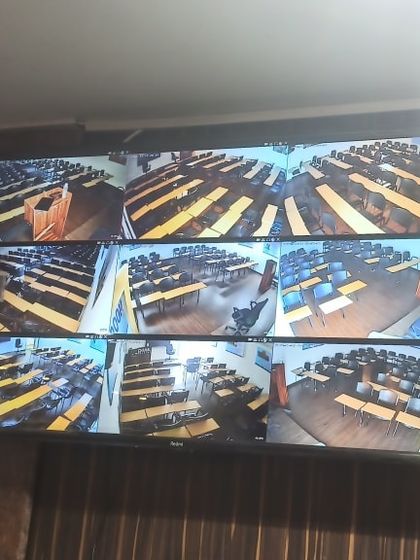 This monitor shows a 9-camera view of a coaching center, ensuring the safety of students and staff.