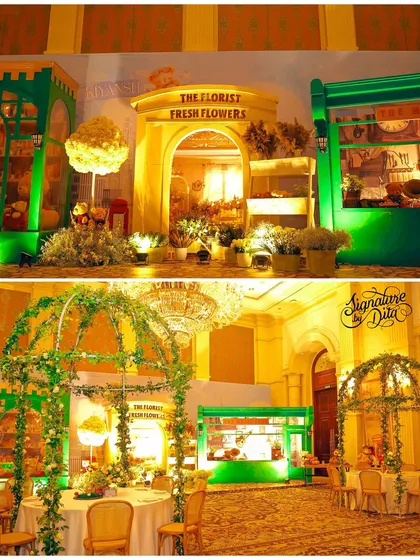 The venue was transformed into a London street, with shop facades like 'The Florist' and vine-covered arches over the dining tables.