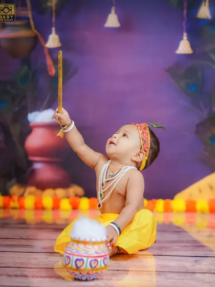 Reaching for the stars, or maybe just a hanging bell. I love capturing these moments of curiosity and exploration during my themed photoshoots.