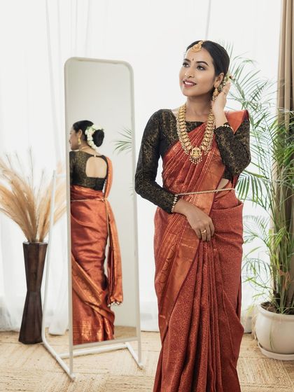 A full-length shot showing how the complete look comes together. The makeup, hair, and styling create an elegant and photogenic result, perfect for a professional portfolio.