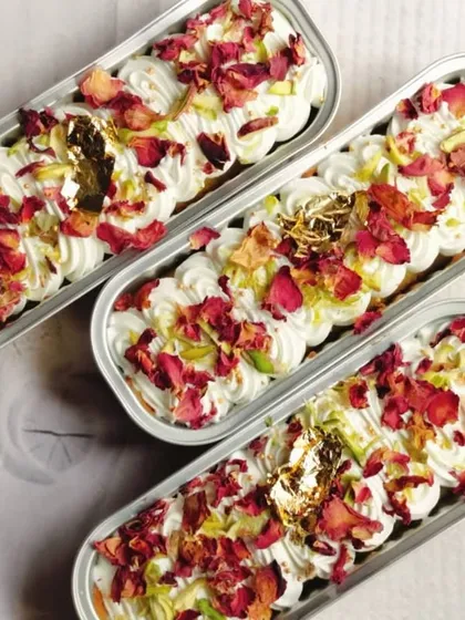 To celebrate Eid, I prepare these stunning Rose and Pistachio Tres Leches Boats. They are decorated with delicate rose petals, crunchy pistachios, and edible gold for a truly special treat.