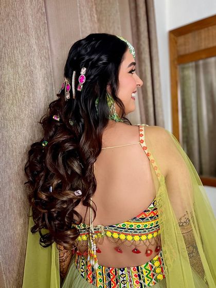 The smile says it all. Surbhi loving her blinged-out mehndi hairstyle.