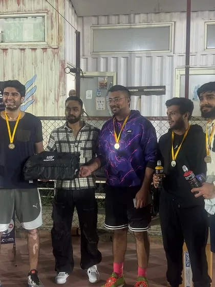 The runners-up, team Shooting Dragons, celebrating their performance. In our leagues, every team is guaranteed more than one match, ensuring plenty of court time.