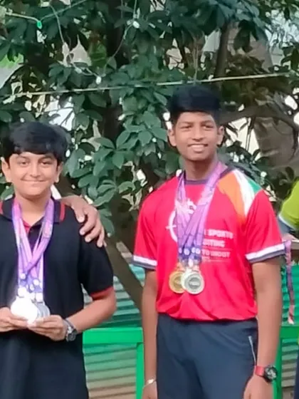 The joy of achievement. Two of our junior shooters celebrate their wins, showcasing the results of their hard work and the supportive environment we foster at the academy.