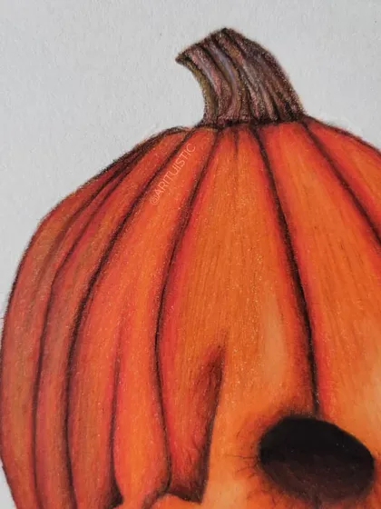 A close-up of the top of the pumpkin skull, showing the texture of the pumpkin skin and stem.