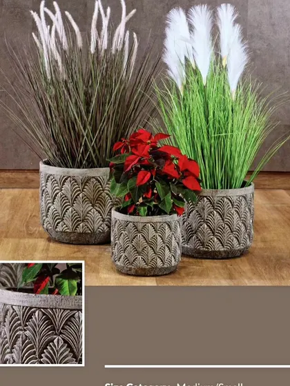 These concrete planters feature an elegant, carved art deco pattern. They are perfect for adding a touch of classic sophistication to your plant collection.
