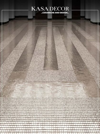 Platinum mosaics installed under a skylight at the Seema Gujral flagship store. The tiles create a delicate, concentric rhythm, playing with reflection and light to evoke a powerful emotion.