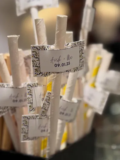 Even the straws get a personal touch. Here, we've added custom flags with the couple's names and wedding date, ensuring every detail is cohesive and thoughtfully designed.