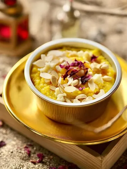 My Pineapple Soufflé is light, airy, and melts in your mouth. This delicate dessert is topped with almond flakes and dried rose petals for a touch of elegance.