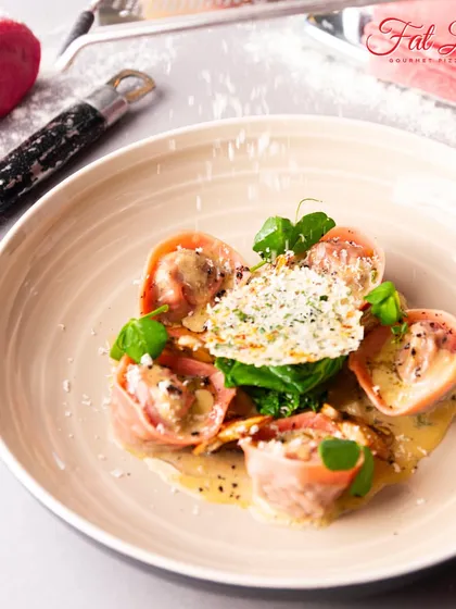 My pasta is an art form. This beetroot-infused ravioli is not only stunning to look at but also filled with a delicious, savory filling.