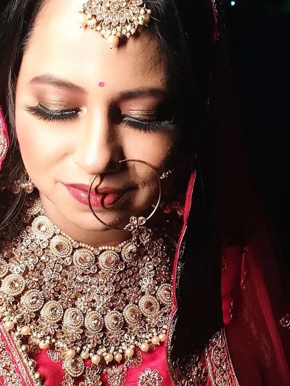 A close up of the bridal eye makeup, showing the soft blend of shimmer and matte eyeshadows. The lashes add just the right amount of drama without overpowering the look.